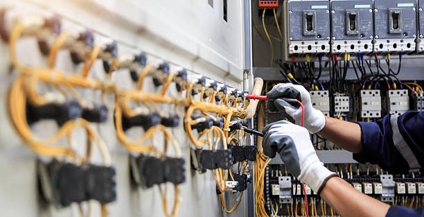 Professional Electrician technician working in Norton Center, MA